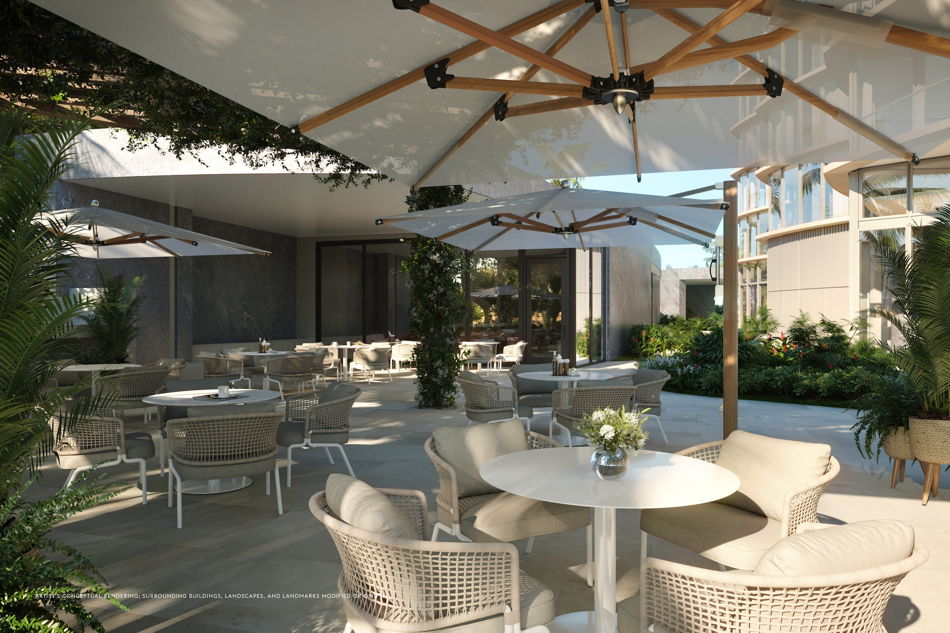 Outdoor amenity deck with shaded lounge seating at a near-completion South Florida luxury condominium