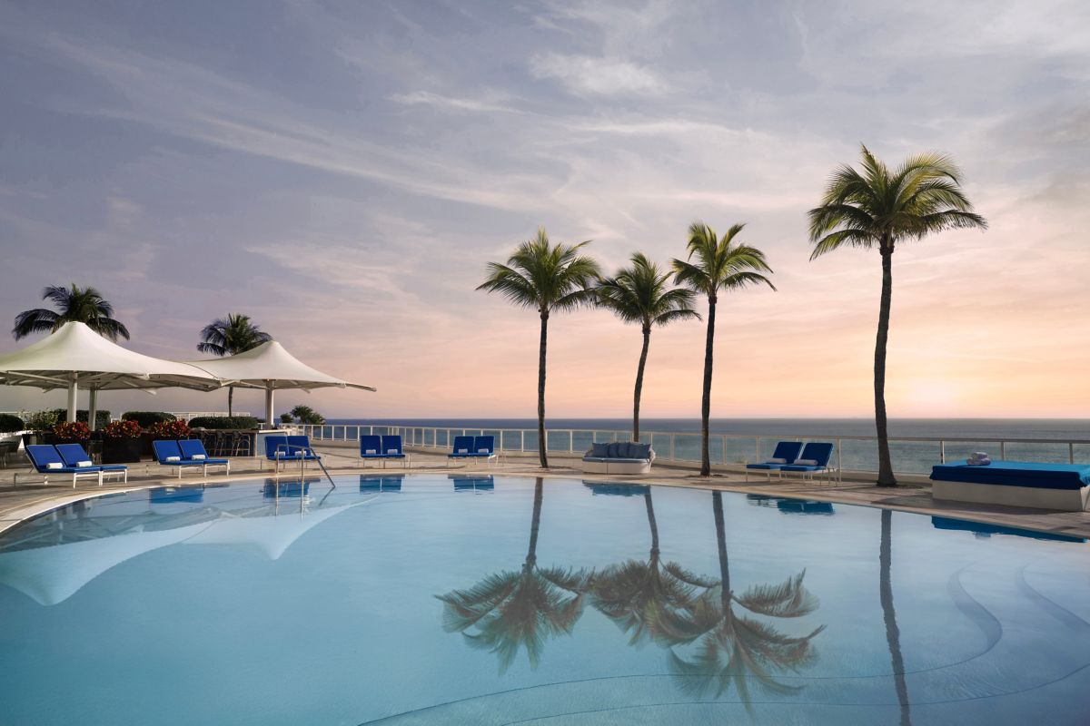 The Ritz-Carlton Residences Fort Lauderdale Beach oceanfront pool deck at sunset