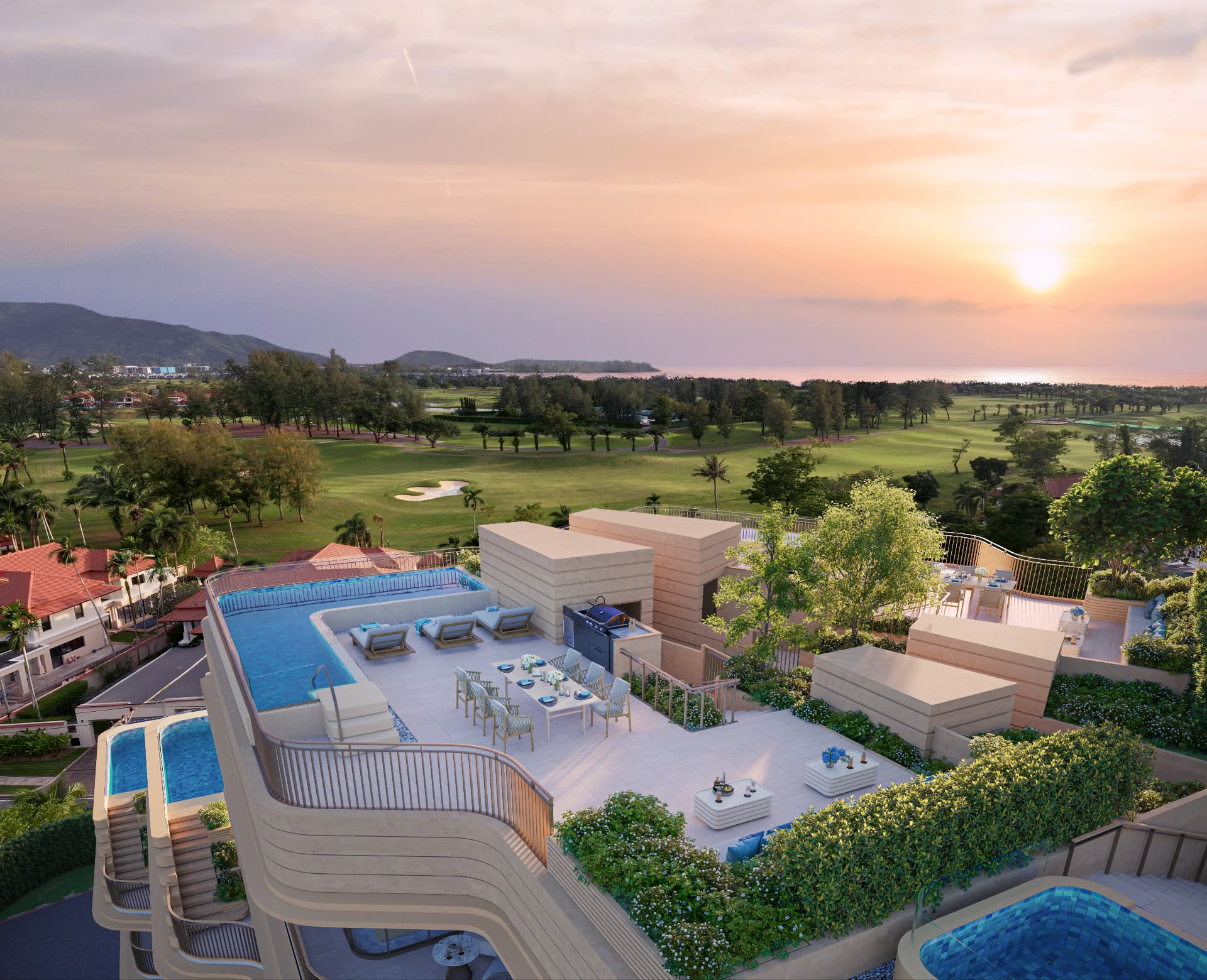 Elevated sunset view of rooftop pool terraces above Bang Tao, Phuket