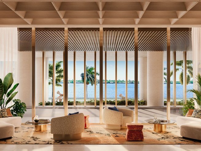 Open kitchen and living area inside a Ritz-Carlton Residences, Palm Beach Gardens home