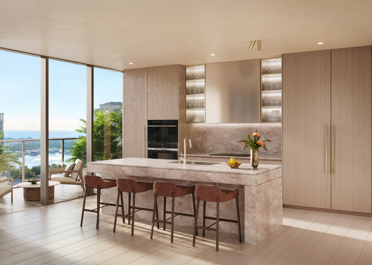 Luxury condo kitchen with marble island and waterfront views