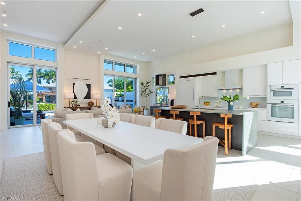Private saltwater infinity pool and outdoor living area with canal views