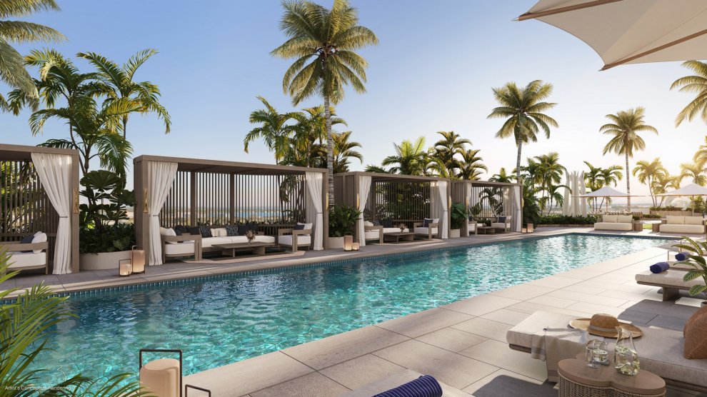 The Ritz-Carlton Residences, West Palm Beach pool deck with cabanas and palm-lined waterfront