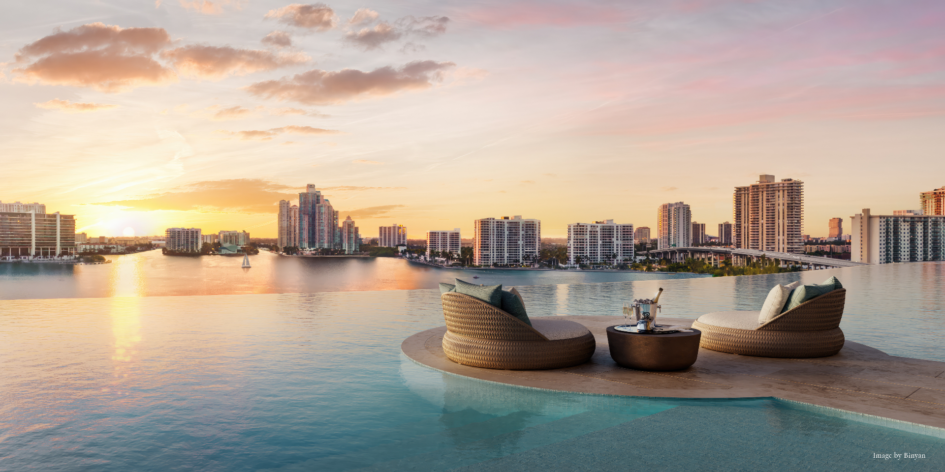 The St. Regis Residences, Sunny Isles Beach — west pool deck at sunset overlooking the Intracoastal Waterway