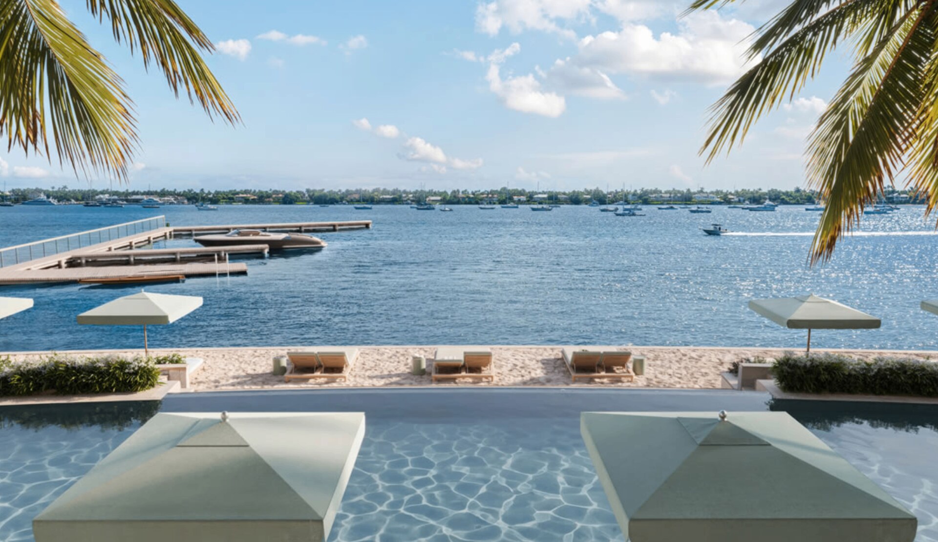 The Residences at Mandarin Oriental, Miami — South Tower lobby with travertine, brass, and bay views