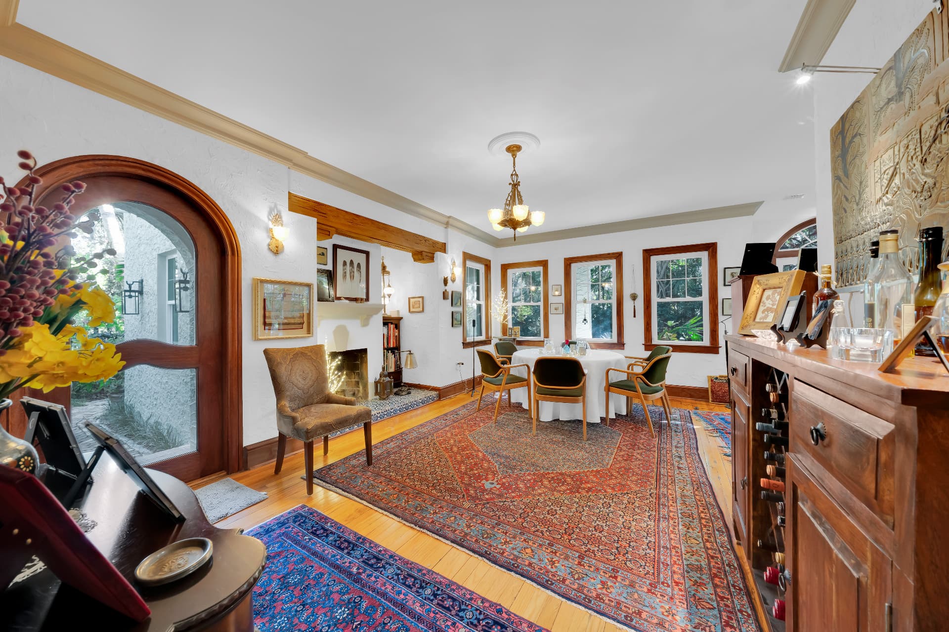 Dining room with arched doorway and hardwood floors