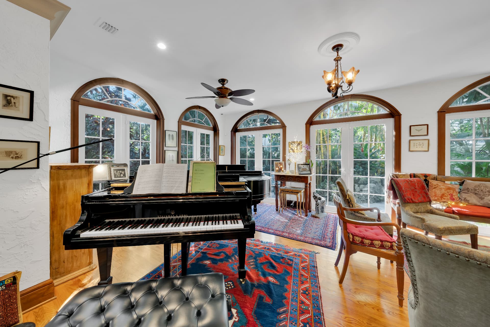 Music room with arched French doors